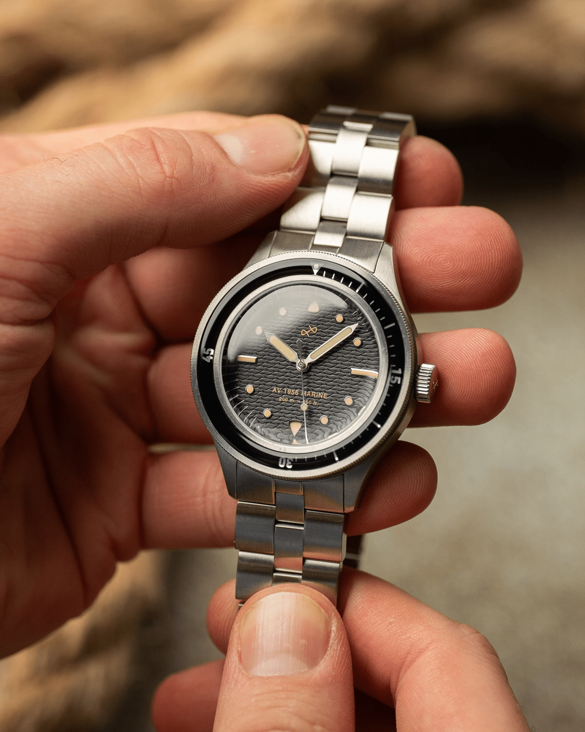 1956 Marine by AV86 vintage-inspired diver with acrylic bezel, big luminous markers, textured dial, and steel bracelet strap