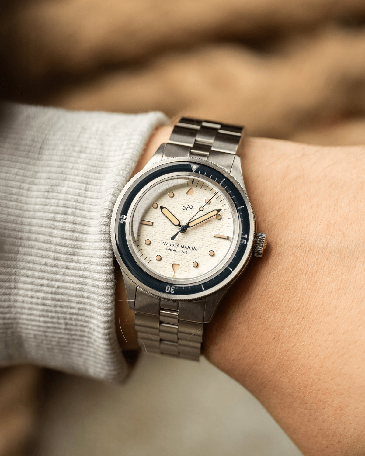 1956 Marine by AV86 vintage-inspired diver watch with acrylic bezel, luminous markers, and brushed metal bracelet strap