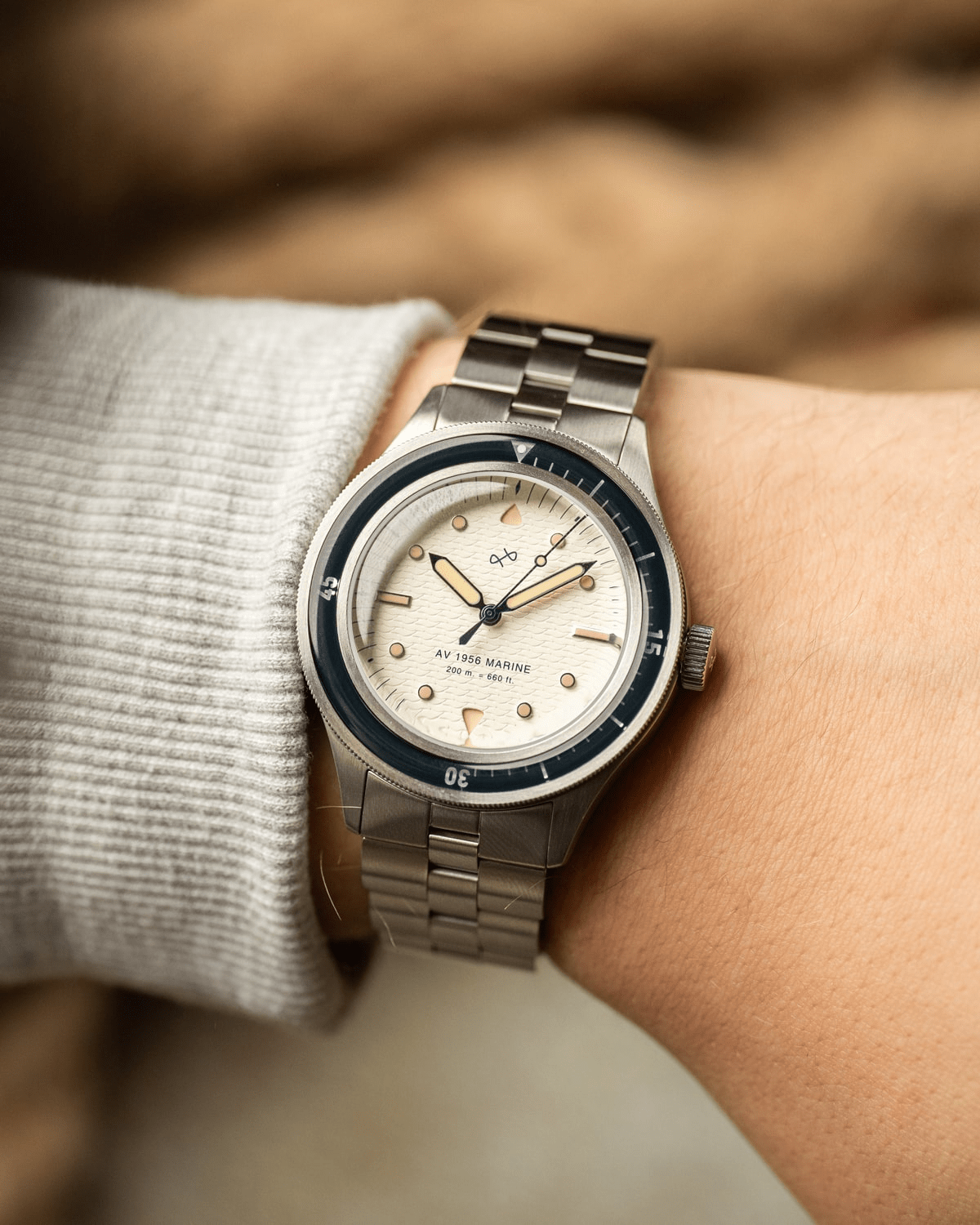 1956 Marine by AV86 vintage-inspired diver watch with acrylic bezel, luminous markers, and brushed metal bracelet strap