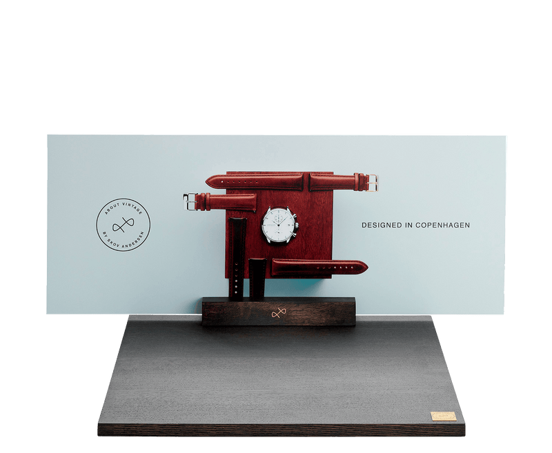 Boards by AV86 minimalist display stand with dark wood, designed for showcasing luxury watches with leather straps