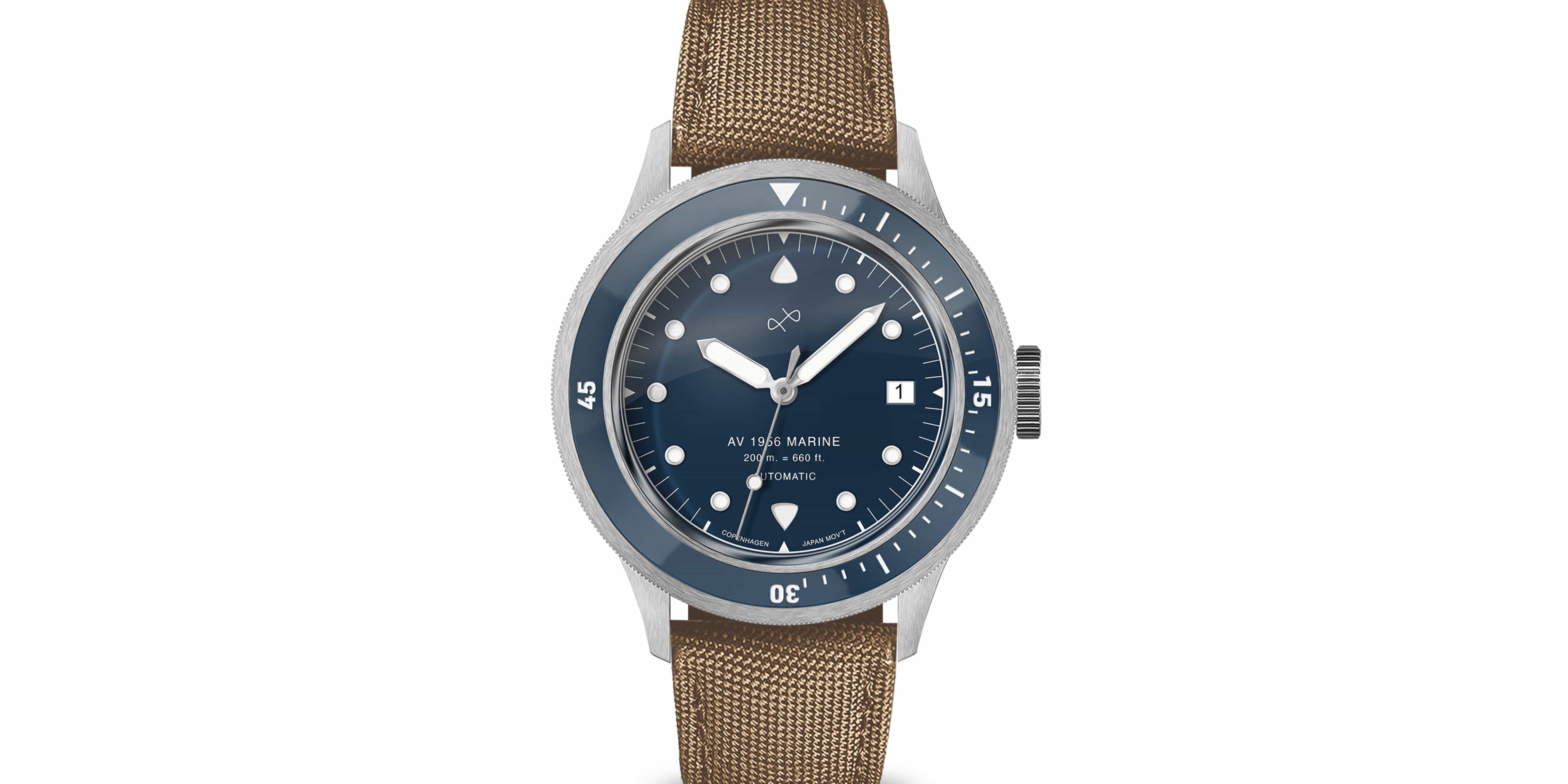 Automatic marine-inspired wristwatch with a deep blue dial, date window, rotating bezel, and textured tan strap.