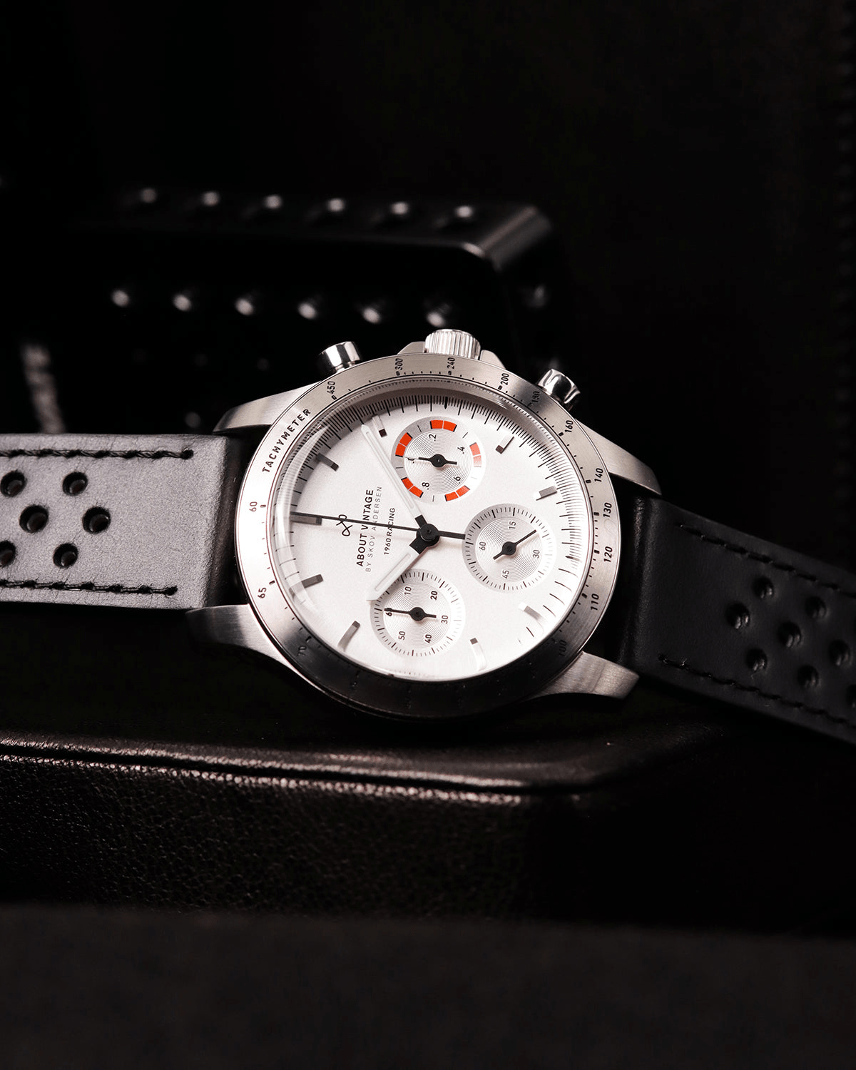 1960 Racing Chronograph by AV86 with vintage-inspired dial, sapphire crystal, tachymeter bezel, and perforated leather strap