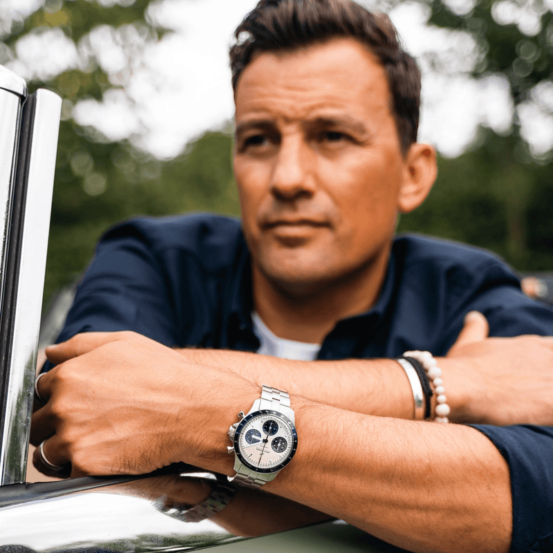 1960 Racing Chronograph by AV86 with vintage-inspired dial, sapphire crystal, chronograph function, and metal bracelet strap in lifestyle setting.