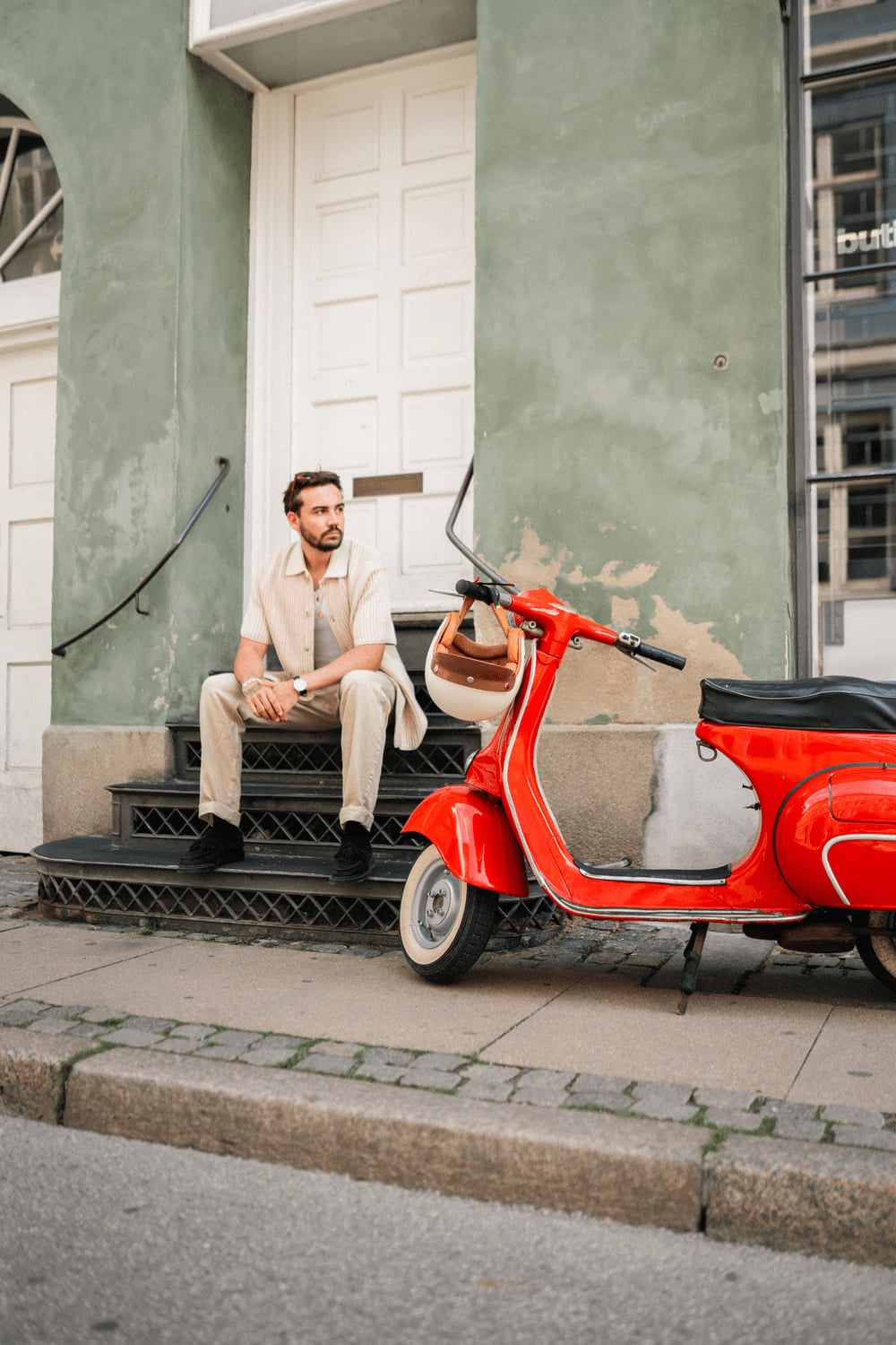 1968 Mechanical by AV86 classic mechanical watch on man seated urban streetwear, vintage European scooter, minimalist vibe