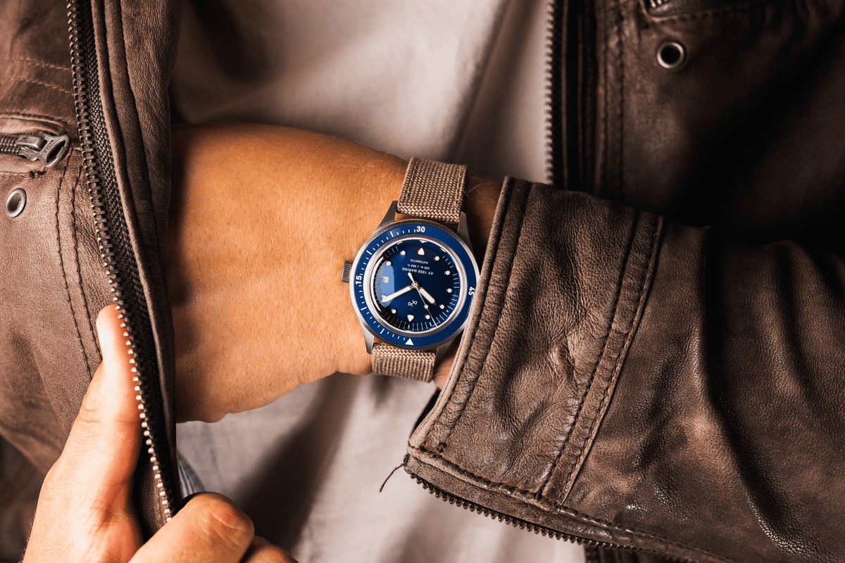 1956 Marine Automatic by AV86 vintage-inspired diver with sapphire crystal, compass bezel, and beige fabric strap