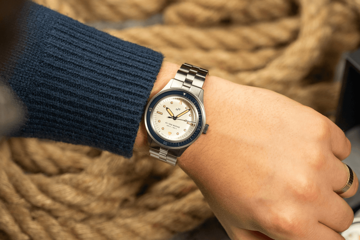 1956 Marine by AV86 vintage-inspired diver with acrylic bezel, luminous markers, sapphire crystal, and metal bracelet strap