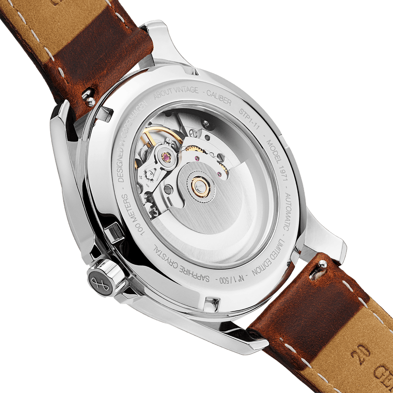 1971 Automatic, Night Blue - Swiss Made by AV86 showcasing exhibition case back, automatic movement, and brown leather strap