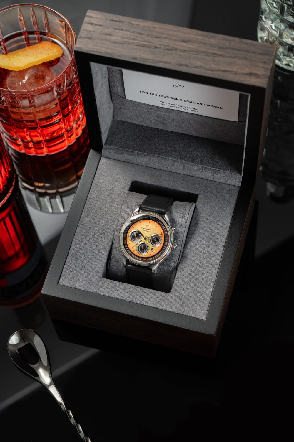 1564 Chronodate Automatic by AV86 vintage-inspired chronograph with sapphire crystal, three subdials, and black leather strap in wooden box
