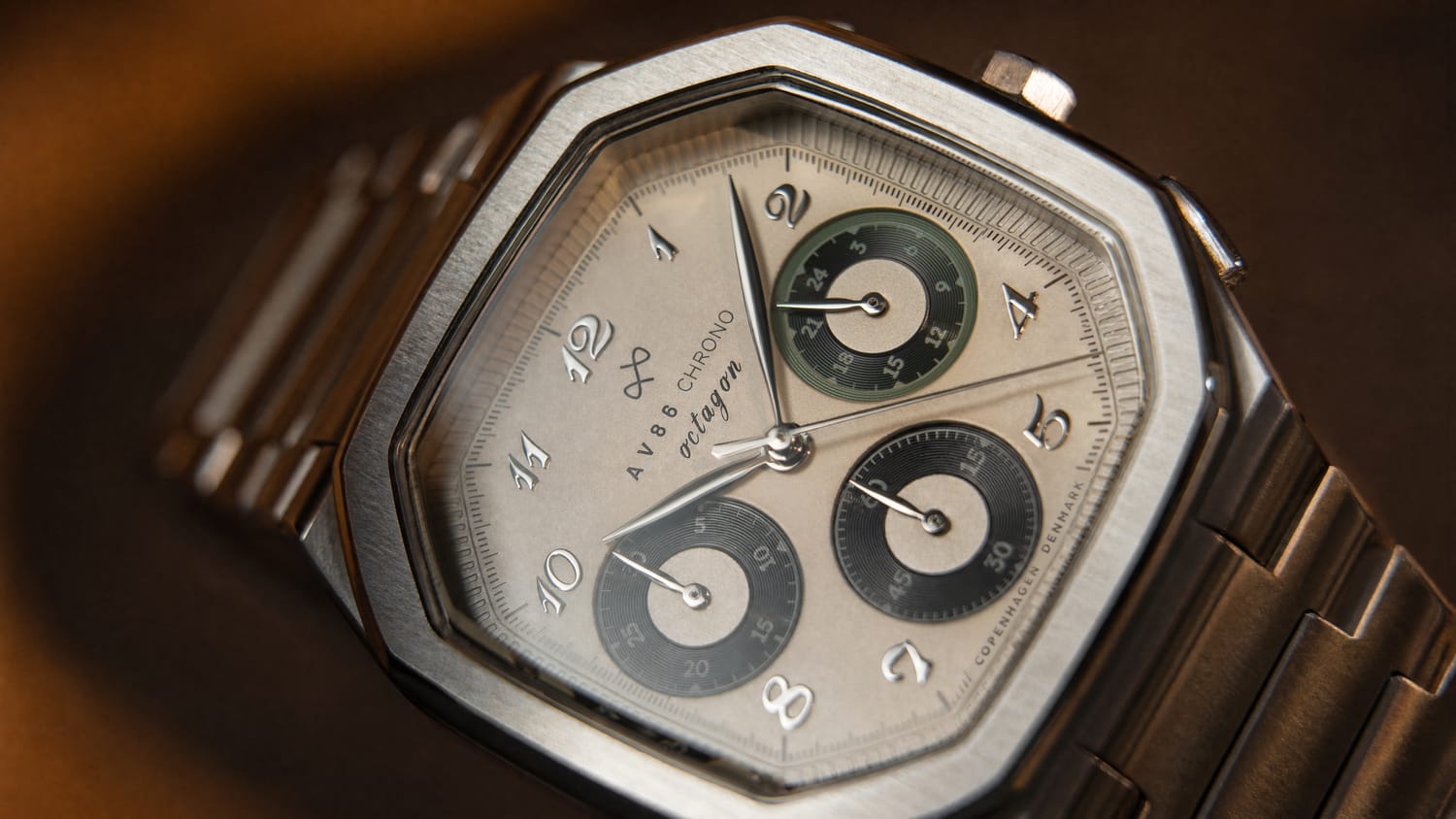1904 Chrono, Steel / Off White & Black by AV86 featuring a luxury chronograph with a stainless steel case, multiple subdials, and a sophisticated metallic bracelet, showcasing Nordic minimalism and horological excellence.