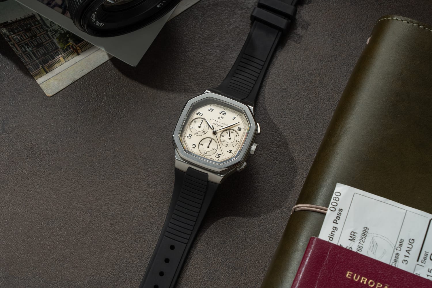 The 1904 Chrono by AV86 features a square chronograph dial with three subdials, sapphire crystal, and a black rubber strap, embodying luxury Nordic minimalism.