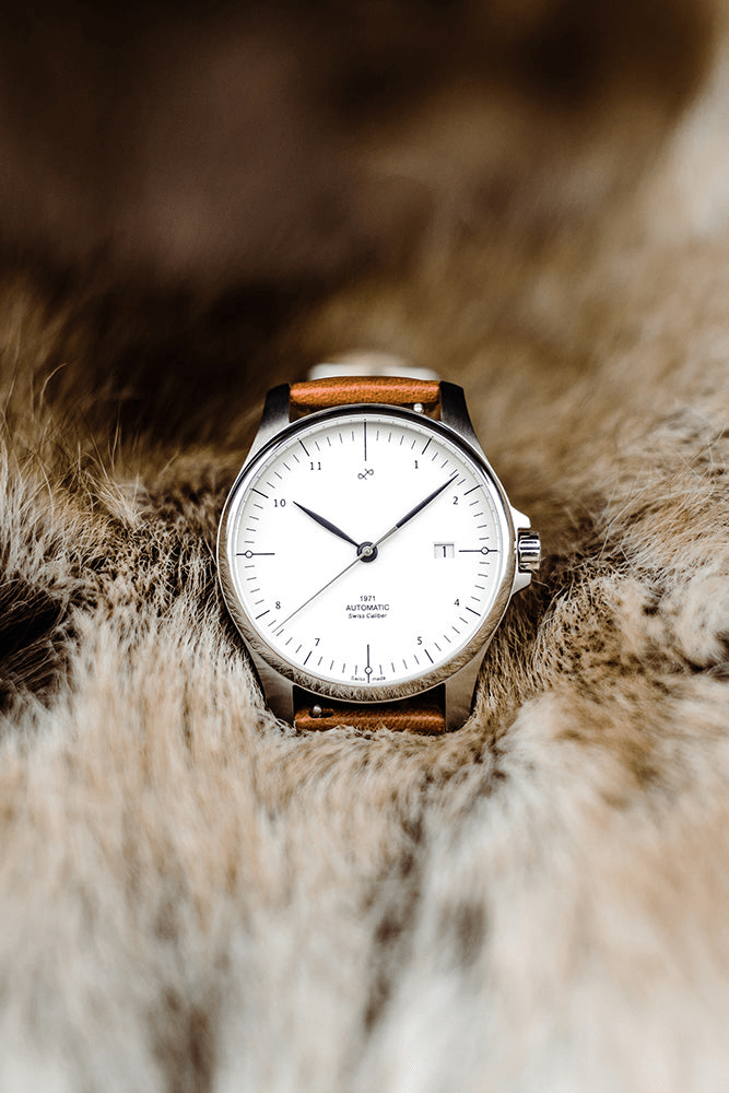 1971 Automatic Swiss Made by AV86 with minimalist dial, date window, sapphire crystal, and brown leather strap