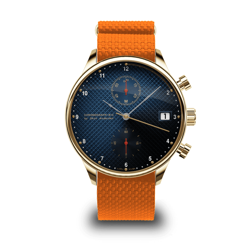 1815 Justin Gatlin, Gold / Blue Turtle by AV86 chronograph with sapphire crystal, textured blue dial, date window, and orange rubber strap