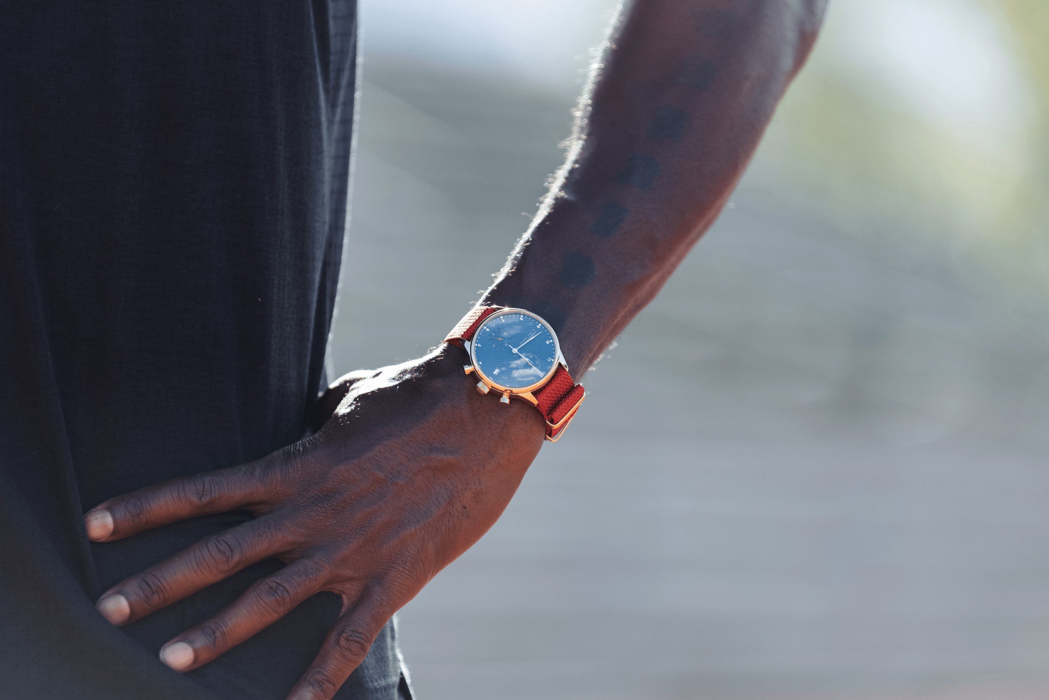 1815 Justin Gatlin by AV86 vintage-inspired chronograph with sapphire crystal and orange fabric strap on wrist