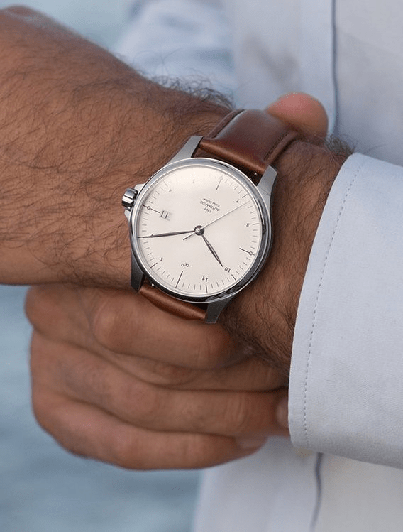 1971 Automatic by AV86 minimalistic luxury timepiece with sapphire crystal, automatic movement, and brown leather strap on wrist