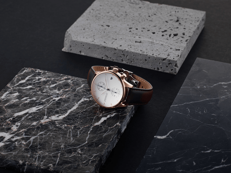1815 Chronograph by AV86 luxury chronograph with sapphire crystal, vintage-inspired dial, and black leather strap on marble surface