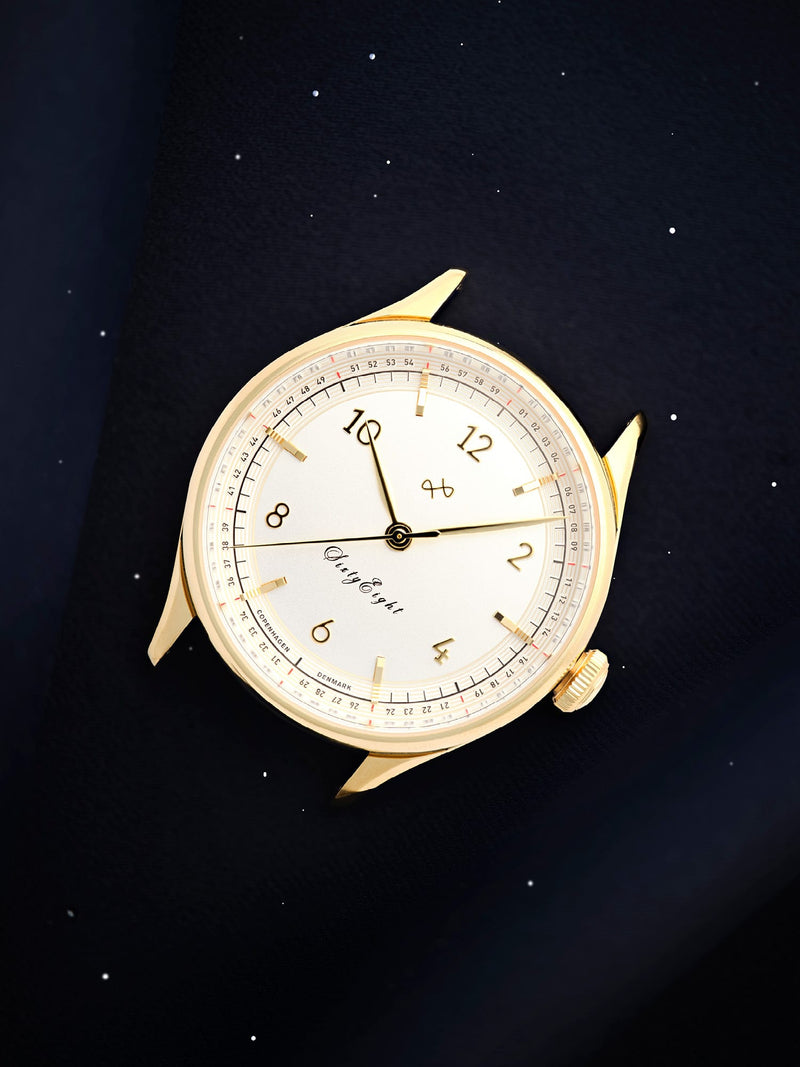 1968 Sixtyeight by AV86 vintage-inspired dress watch with sapphire crystal, gold case, white dial, and refined minimalist markers