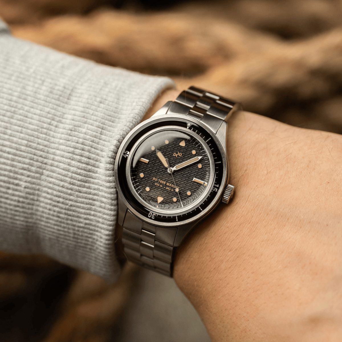 1956 Marine by AV86 vintage-inspired diver with acrylic bezel, luminous markers, textured dial, and metal bracelet strap