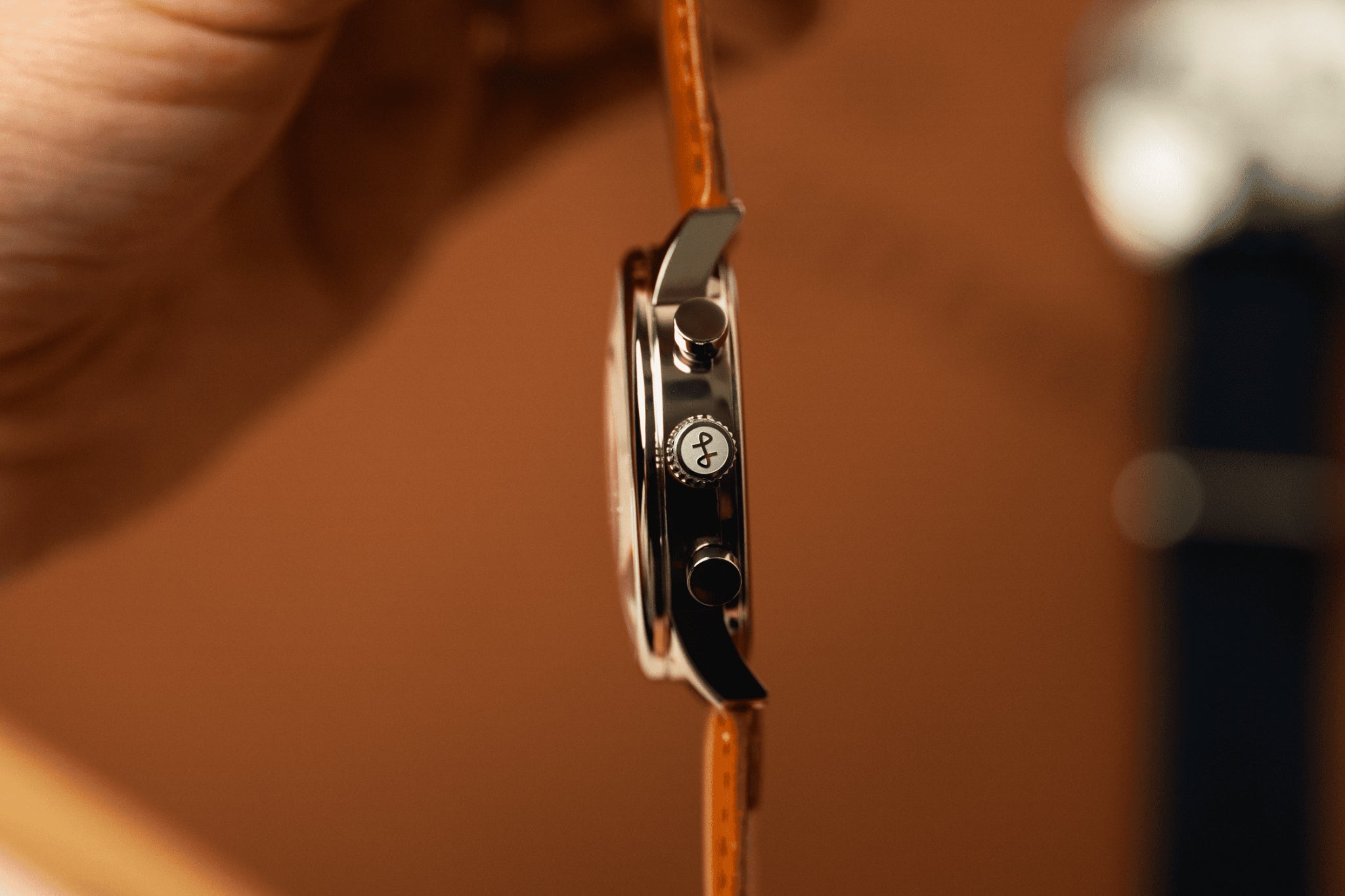 1834 Chronograph by AV86 with polished steel case, chronograph pushers, engraved crown, and brown leather strap