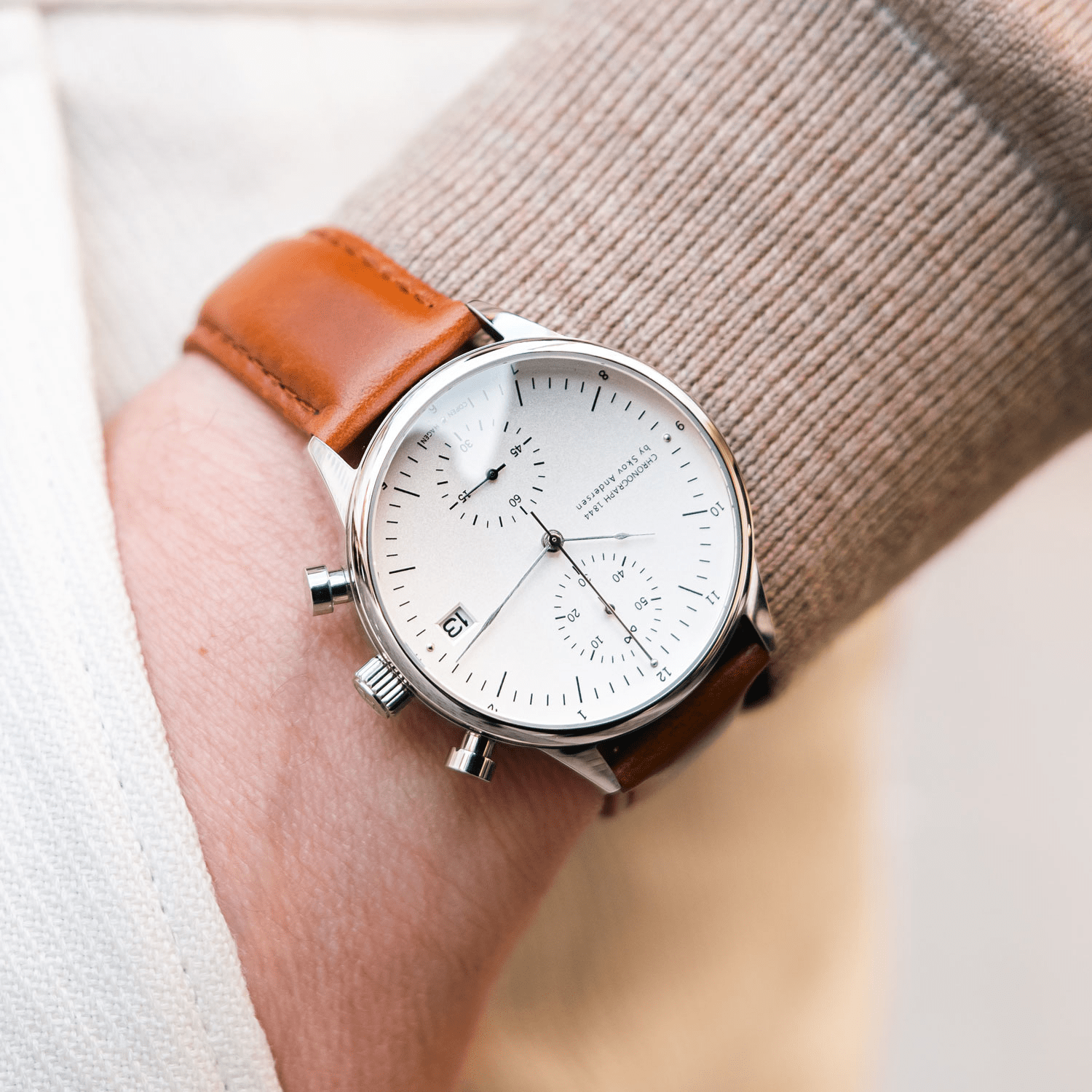 Wristwatch with a brown leather strap and white dial, featuring chronograph and date display, by AV86 Shopify Test.