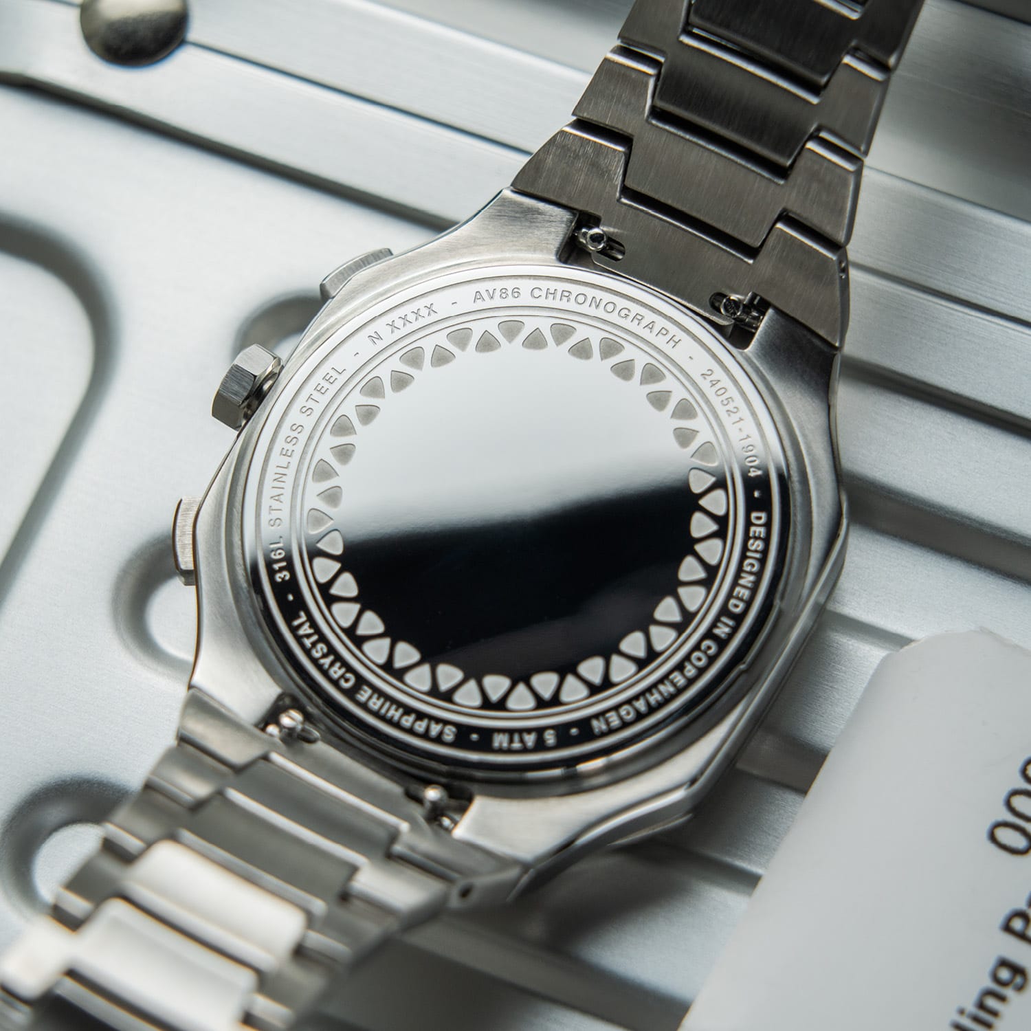 AV86 chronograph with stainless steel case back, sapphire crystal, 5ATM water resistance, and stainless steel bracelet strap