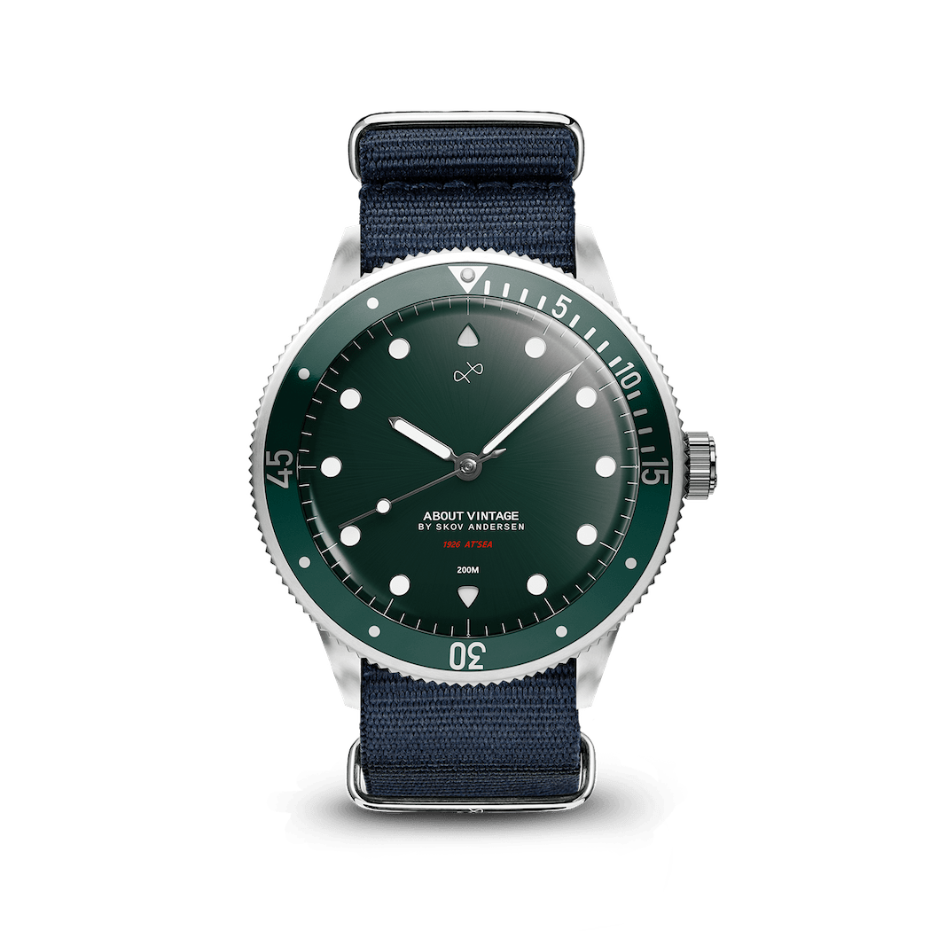1926 At'sea by AV86 vintage-inspired diver with sapphire crystal, rotating bezel, green sunray dial, and navy fabric strap
