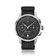 1934 Telechron, Steel / Black by AV86 features a vintage-inspired chronograph with a black dial, dual subdials, date window, sapphire crystal, polished steel case, and textured black fabric strap, exemplifying Danish horological precision and Nordic minimalism.