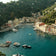 Scenic view of a coastal town with boats in harbor, evoking the elegance of the 1954 Amalfi Mechanical, Steel / Off White by AV86.