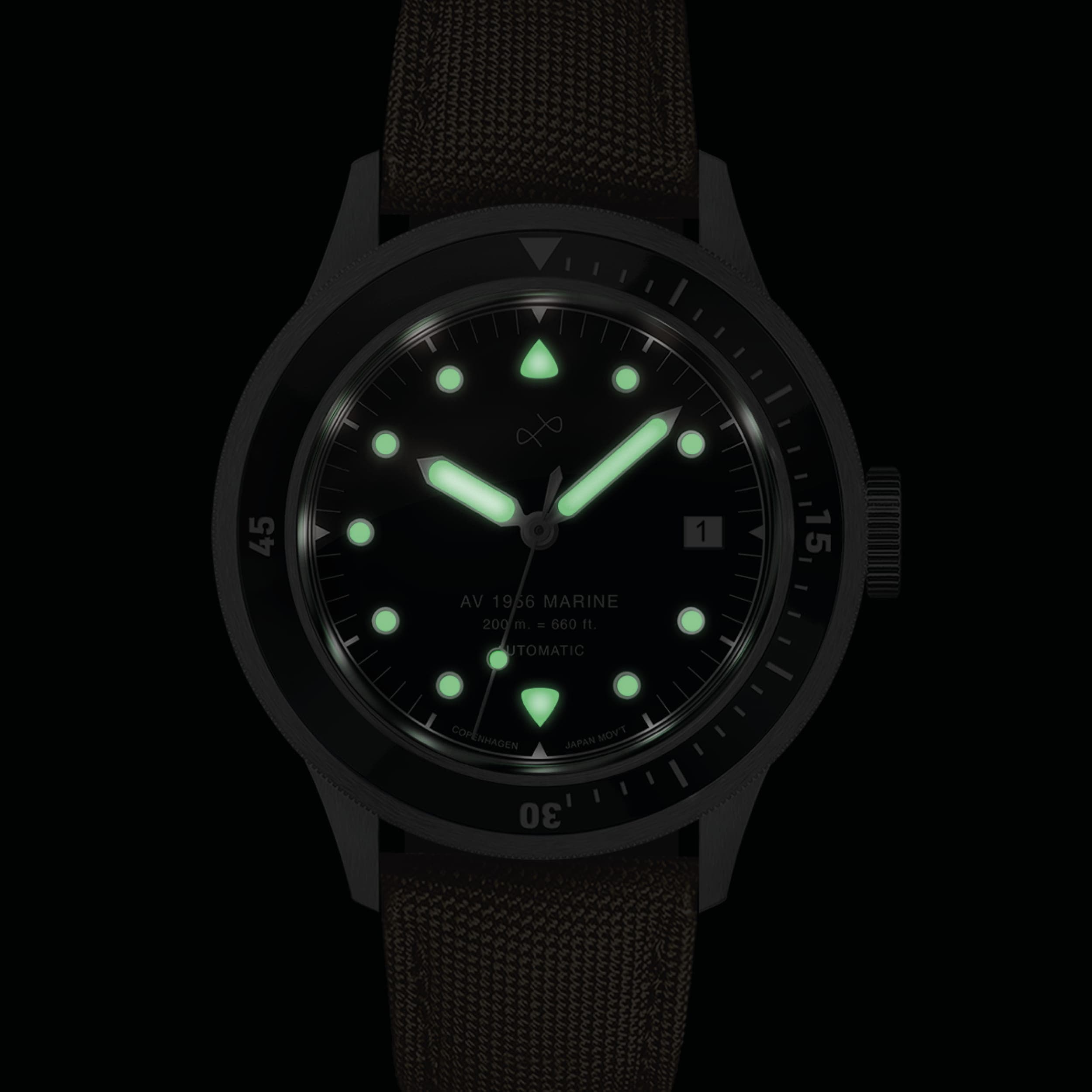 1956 Marine Automatic, Steel / Black with glowing markers and hands, vintage-inspired watch by AV86 in low light setting
