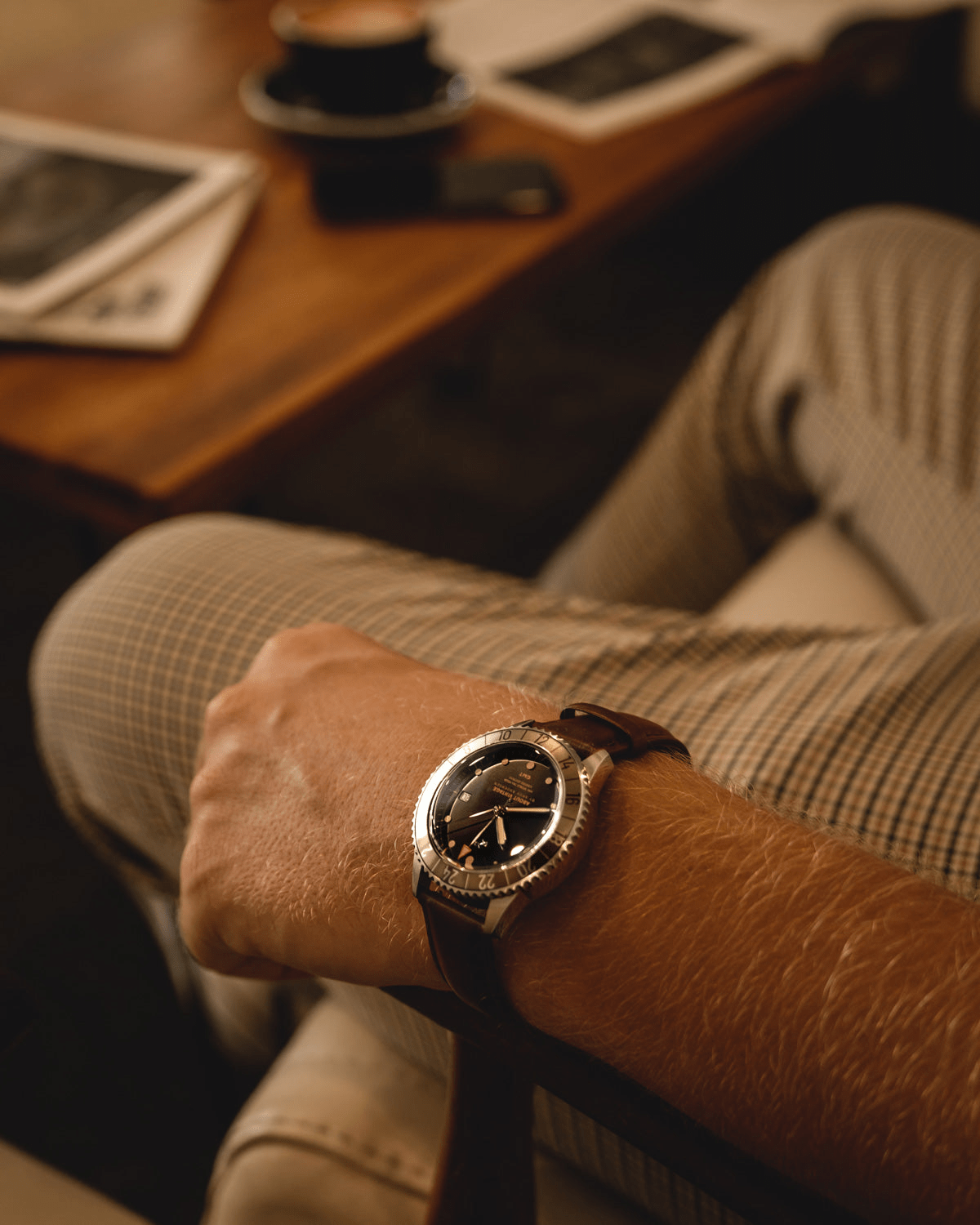 1982 GMT World Traveler by AV86 vintage-inspired GMT quartz watch with sapphire crystal and leather strap in a relaxed setting
