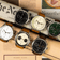 1934 Telechron by AV86 showcases a collection of vintage-inspired chronographs with sapphire crystals, polished steel cases, and leather straps, reflecting refined Danish design and Nordic minimalism in a sophisticated lifestyle setting with newspapers and classic style elements.