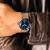 1956 Marine Automatic by AV86 vintage-inspired diver with sapphire crystal, compass bezel, and textured fabric strap on wrist