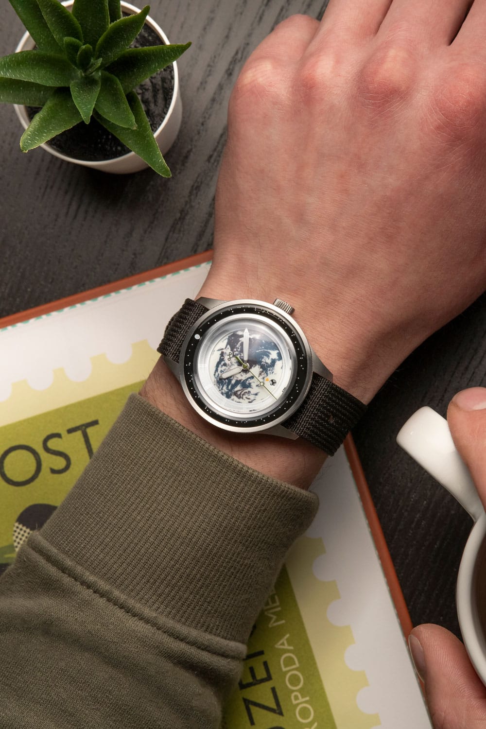 Earthrise WWF Partnership, Automatic / 2025 Edition by AV86 with vintage-inspired dial featuring Earth motif, automatic movement, and fabric strap