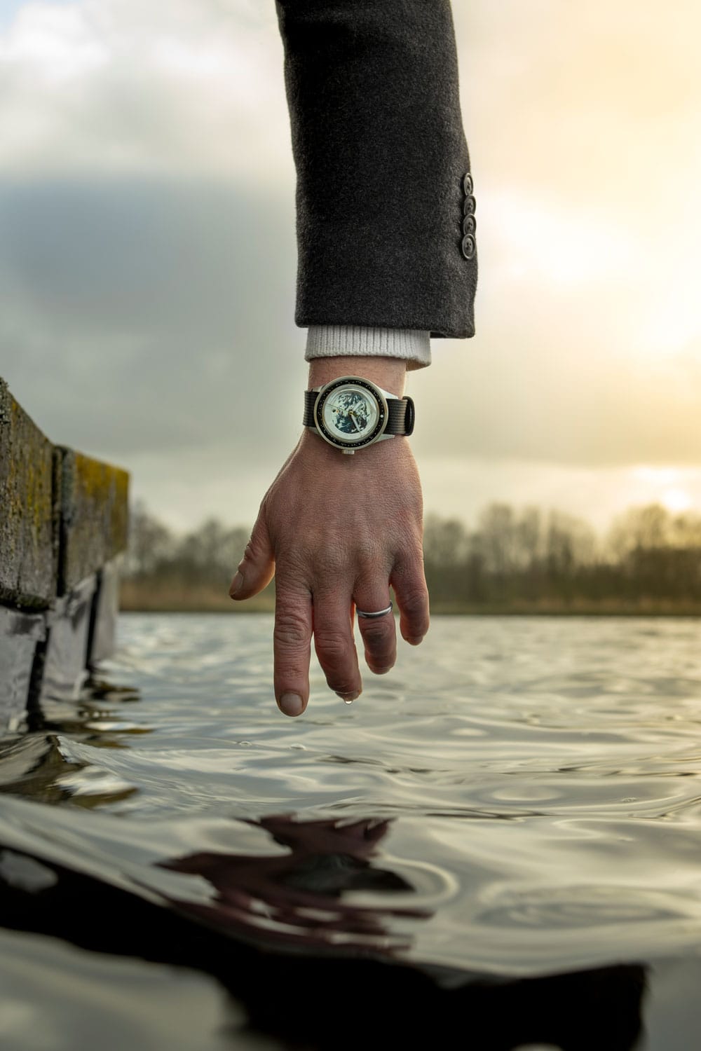 Earthrise WWF Partnership, Automatic / 2025 Edition by AV86 with automatic movement, sapphire crystal, and black leather strap in outdoor setting