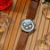 1564 Chronodate Automatic by AV86 features a vintage-inspired chronograph with sapphire crystal and leather strap, styled in a warm, casual setting with citrus fruits and ice cubes.