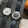 1564 Chronodate Automatic, Steel / White by AV86 presents a vintage-inspired automatic chronograph with a white dial featuring three subdials, polished stainless steel case, sapphire crystal, and a black leather strap, embodying refined Danish design and Nordic minimalism.