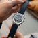 1564 Chronodate Automatic by AV86 features a vintage-inspired automatic chronograph with a textured dial, triple subdials, polished case, and a deep blue patterned leather strap, reflecting refined Danish horological craftsmanship and Nordic minimalism.