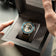 Earthrise WWF Partnership, Automatic / 2026 Edition by AV86 luxury watch with green strap in presentation box held by hands