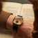 1954 Amalfi Mechanical by AV86, vintage-inspired automatic watch with sapphire crystal and leather strap in a classic setting with book pages