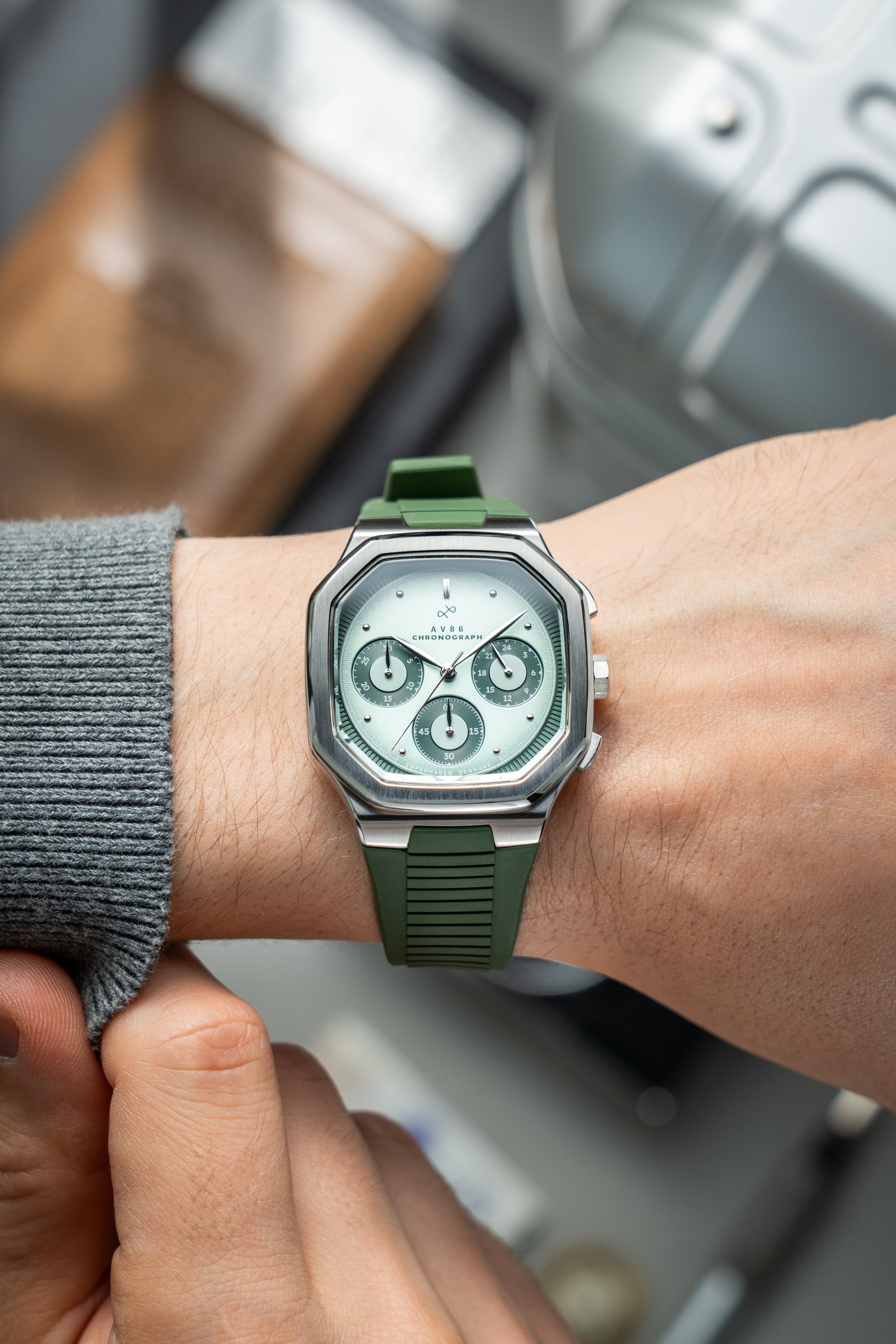 1904 Chronograph by AV86 with angular case, sapphire crystal, chronograph dial, and textured rubber strap in minimalist style