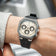 1904 Chronograph by AV86 with angular case, sapphire crystal, chronograph subdials, and black rubber strap on wrist