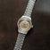 1956 Marine Automatic, Steel / Sand wristwatch by AV86 with a steel bracelet and sand-colored dial on dark brown background