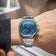 1904 Chronograph by AV86 with angular case, sapphire crystal, blue vintage-inspired dial, and polished steel bracelet strap