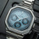 1904 Chronograph by AV86 with angular case, textured dial, sapphire crystal, chronograph subdials, and brushed steel bracelet strap