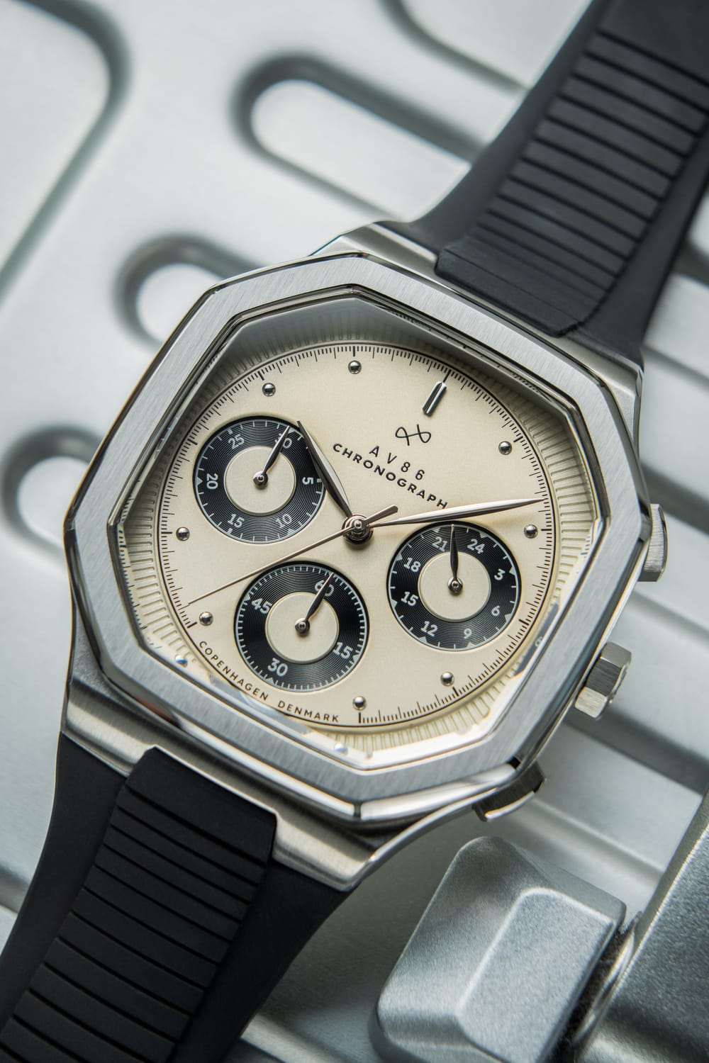 1904 Chronograph by AV86 with angular case, vintage-inspired dial, sapphire crystal, black rubber strap, and precise subdials