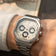 Wristwear featuring the 1904 Chrono by AV86, a luxury chronograph with a hexagonal stainless steel case, sapphire crystal, and a linked metal bracelet in a refined, minimalist setting.