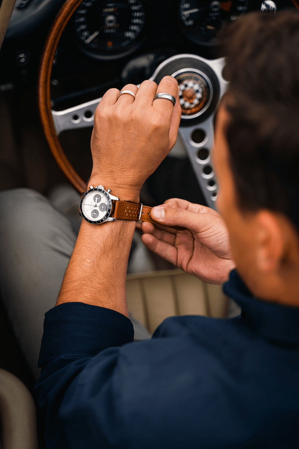 1960 Racing Chronograph by AV86 with vintage-inspired dial, sapphire crystal, chronograph subdials, and perforated leather strap in classic setting