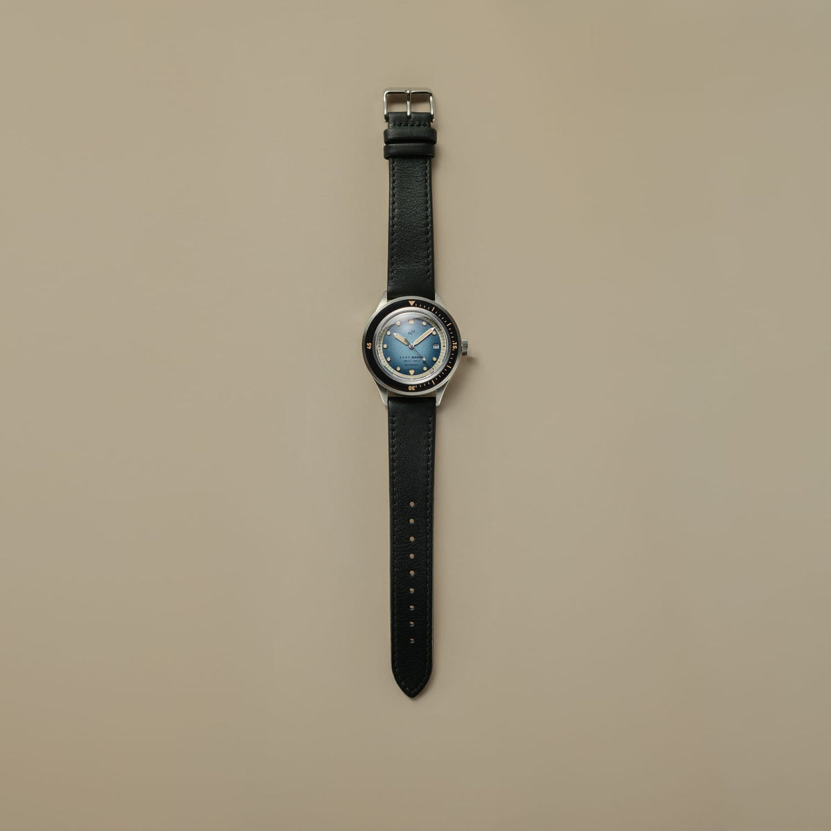 1956 Marine Automatic, Steel / Blue Fade vintage-inspired watch by AV86 with blue fade dial and black leather strap in Nordic minimalist style