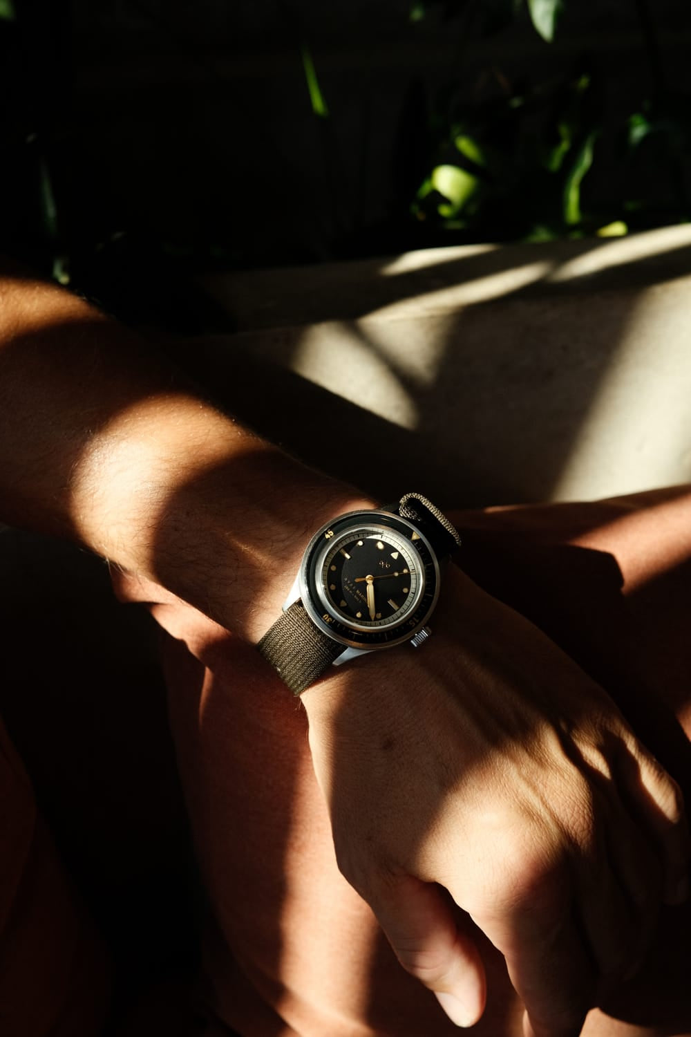 1956 Marine by AV86 vintage-inspired diver watch with compass bezel, domed sapphire crystal, and textured fabric strap on wrist
