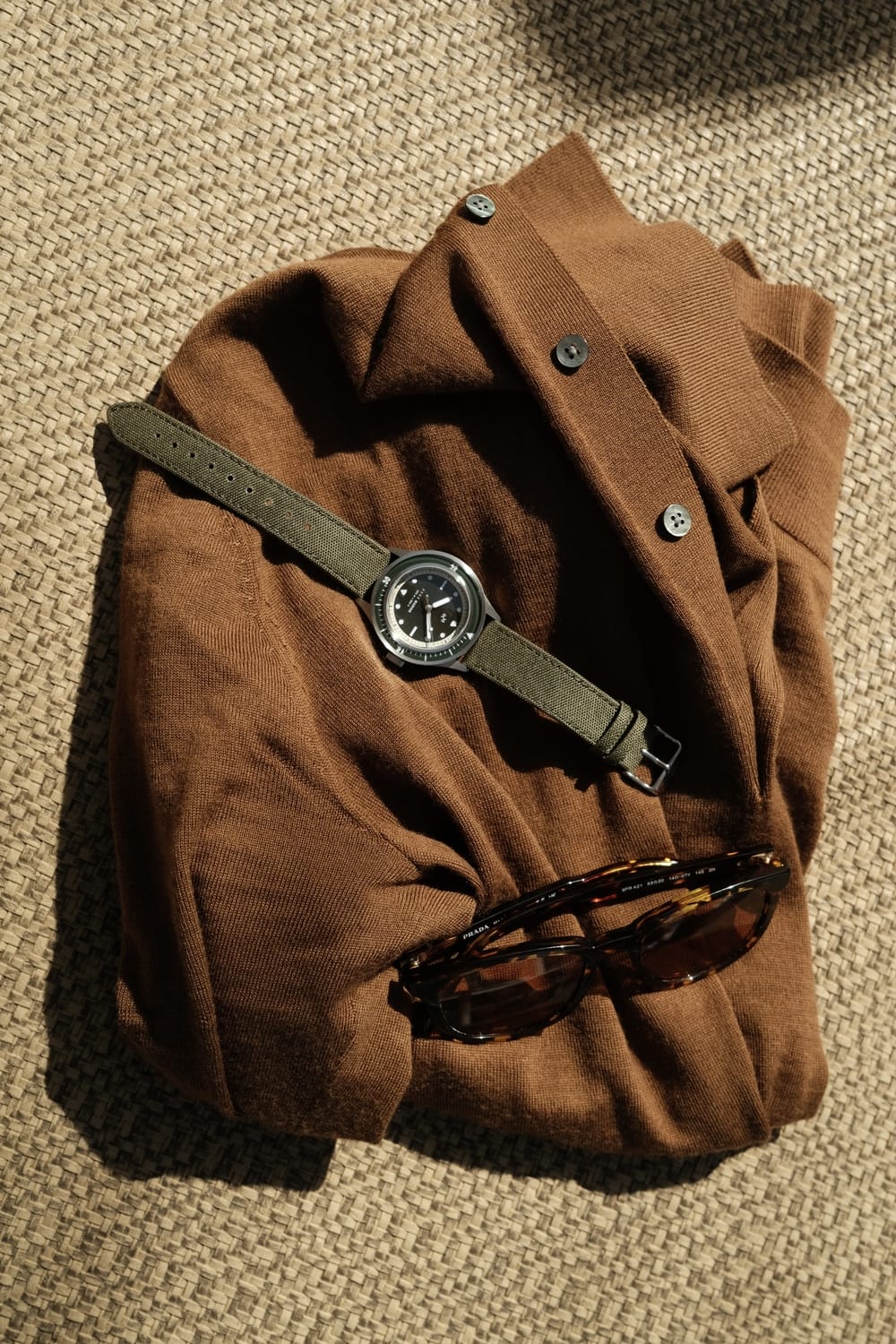 1956 Marine by AV86 vintage-inspired diver watch with sapphire crystal, compass bezel, and textured fabric strap on casual attire