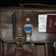 1904 Chronograph by AV86 with angular case, sapphire crystal, chronograph dial, and brushed metal bracelet strap on leather bag